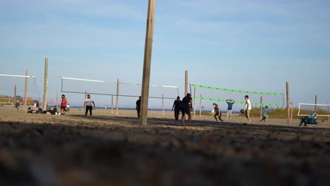 People-play-volleyball-at-Ashbridge's-Bay-Volleyball-Courts-nets-in-Toronto,-ON