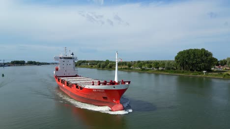 Aerial-Drone-View-Of-A2B-Proud-Cargo-Ship-Sailing-Along-Oude-Maas-In-Zwijndrecht