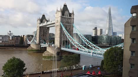 tower-bridge-and-The-Shard-on-the-river-Thames-in-London-city-center-urban-metropolitan-skyline,-zoom-out-view-on-a-bright-day