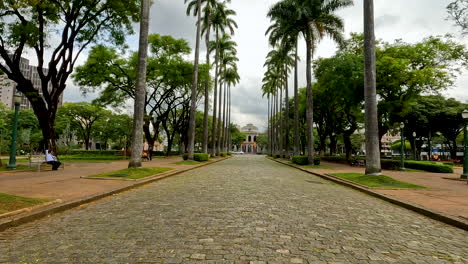 Hyper-lapse-of-architectural-and-landscape-beauty-of-Praça-da-Liberdade-with-people-and-cars-crossing,-Belo-Horizonte,-Brazil