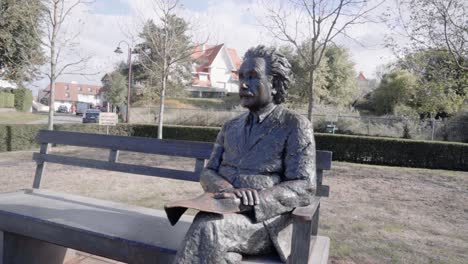 Statue-Of-Albert-Einstein-Sitting-On-A-Park-Bench-In-De-Haan,-Belgium---wide