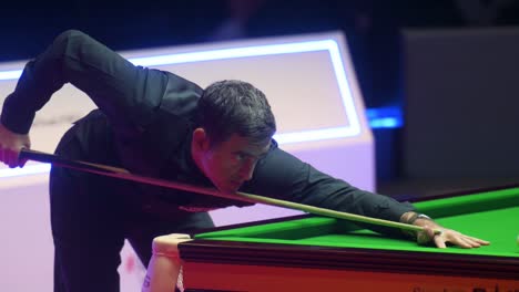 English-snooker-player-Ronnie-O'Sullivan,-World-Champion-and-World-Number-One,-is-seen-in-action-as-he-strikes-a-ball-during-a-match-at-the-Hong-Kong-Masters-snooker-tournament-event