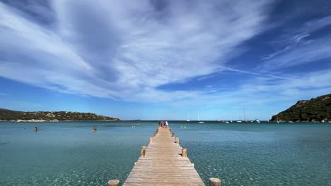 Santa-Giulia-beach-wooden-pier-in-Corsica-island,-France