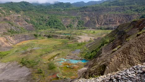 Panoramic-view-of-closed,-abandoned-Panguna-copper-and-gold-mine-pit-landscape-in-tropical-central-Bougainville,-Papua-New-Guinea