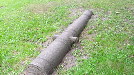 Old-Cannon-Artillery-Gun-in-the-Ground-at-Jelgava-Palace-Museum-Outdoors