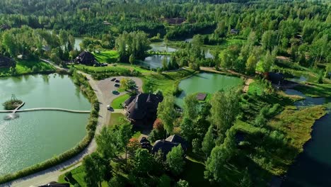 Aerial-view-of-nature-friendly-neighborhood-of-Amatciems-around-freshwater-lakes,-relaxed-lifestyle-in-picturesque-location,-Latvia