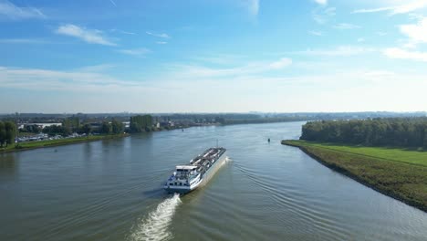 Aerial-Ascending-View-From-Stern-Of-Comus-2-Inland-Tanker-Along-Oude-Maas