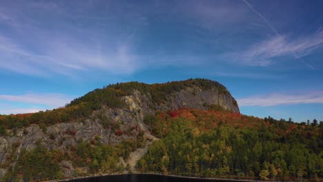 Aerial-pull-away-from-Kineo-Mountain-over-Moosehead-lake-in-autumn