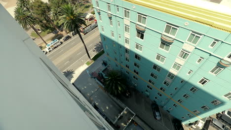Looking-down-into-an-alley-at-parking-spots-from-the-top-of-a-beachside-apartment-building-at-Santa-Monica-California