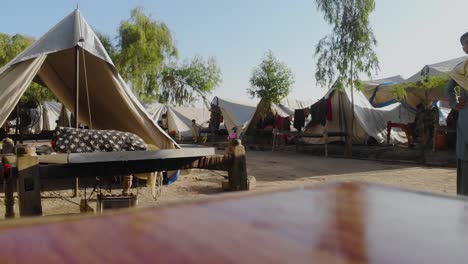 Low-Angle-Table-top-Shot-View-Of-Makeshift-Camps-For-Flood-Disaster-Victims-In-Jacobabad,-Sindh