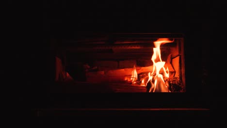 Slow-motion-of-a-flames-beginning-to-light-a-fire-in-woodstove-fireplace