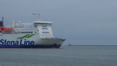 Big-ferry-ship-Stena-Line-arriving-at-Port-of-Liepaja-,-overcast-autumn-day,-medium-shot-from-a-distance