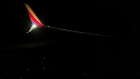 Southwest-Airline-Wing-Symbol-on-a-Plane-at-Night,-4K