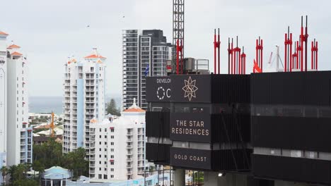 Star-Residences-Gold-Coast-construction-site,-luxury-living-building-in-progress-with-scaffolding-at-Broadbeach-Island,-Queensland,-Australia,-static-shot