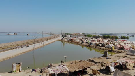 Aerial-Drone-Flying-Over-Makeshift-Camps-For-Flood-Disaster-Victims-In-Maher-On-Sunny-Day