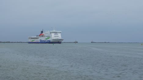 Big-ferry-ship-Stena-Line-arriving-at-Port-of-Liepaja-,-overcast-autumn-day,-wide-shot