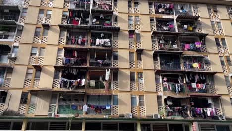 Laundry-hanging-out-to-dry-outside-a-local-residential-block-in-Kuala-Lumpur,-Malaysia