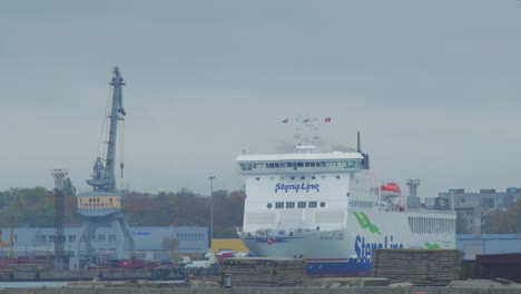 Big-ferry-ship-Stena-Line-parked-at-Port-of-Liepaja-,-overcast-autumn-day,-medium-shot-from-a-distance