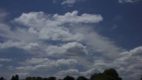 Timelapse-of-white-clouds-moving-across-blue-sky