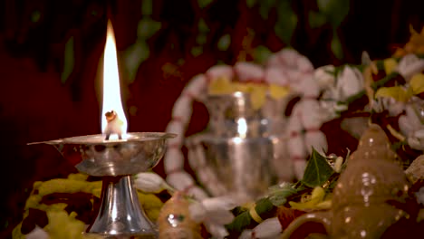 Silver-Diyas-in-front-of-the-gods-which-are-used-lighting-up-the-house-during-pooja-times-in-Hindu-religion