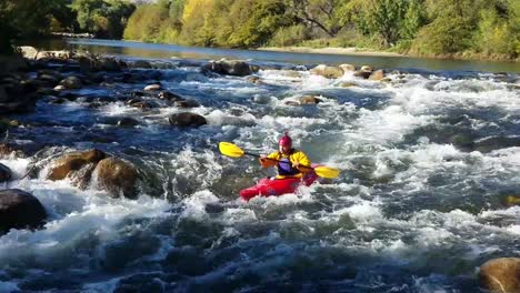 whitewater-kayaker-going-down-class-2-rapids