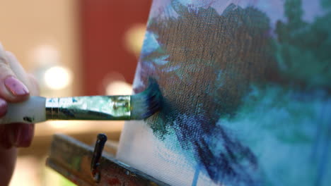 SLOW-MOTION-CLOSE-UP-video-of-female-artist-painting-on-canvas