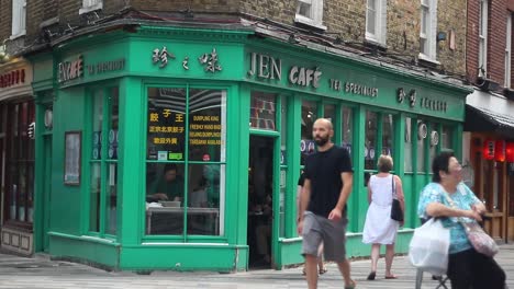 Establishing-Shot-of-a-local-Chinese-restaurant-in-Chinatown-in-London-with-people-passing-by