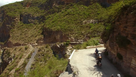 Aerial-Of-Motorcycle-Riders-Riding-Motorbike-On-Mountain-Roads