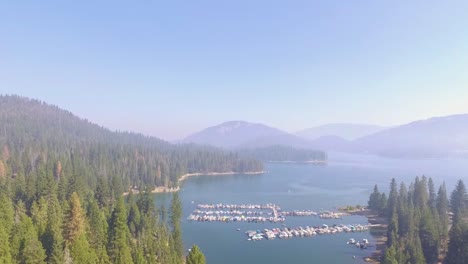 Rising-aerial-flyover-of-a-small-marina-with-docked-boats-at-Shaver-Lake-in-the-California-Sierra-Nevada-mountains