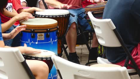 Children's-hands-play-hand-drums-in-a-drum-circle