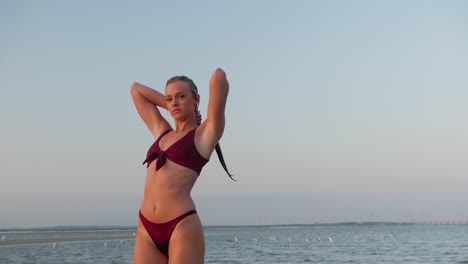 Beautiful-blonde-model-posing-at-the-beach-in-a-bikini-set