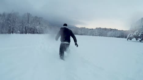 Man-running-in-deep-snow