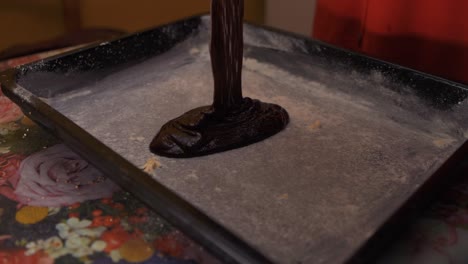 Pouring-dark-chocolate-cake