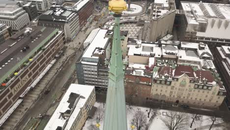 Extreme-close-up-footage-showing-every-detail-of-architectural-works-of-Saint-Klara-church-and-tower,-vertical-downward-panning-motion