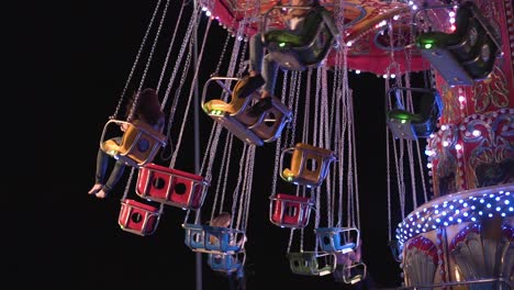 Colorful-carousel-at-night-in-a-park-in-slow-motion