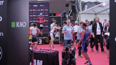 Tripod-shot-of-people-running-and-passing-the-finish-line-at-the-KMD-Ironman-Copenhagen-2018