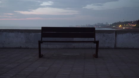 Sunset-over-Empty-Bench-in-Jetty-in-Miraflores,-Lima,-Per?