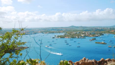 Luxury-yacht-sailing-through-the-Spanish-Waters-harbor-in-Curacao,-Caribbean