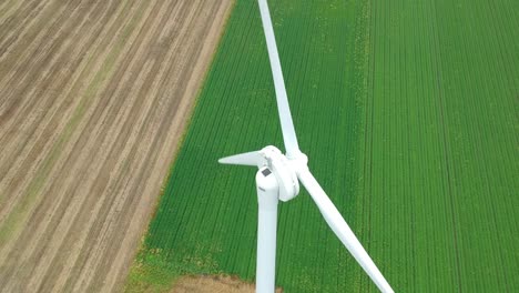 Slow-tilting-ascending-shot-over-wind-turbine