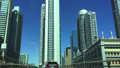 Point-of-view-driving-a-car-up-the-on-ramp-to-The-Gardiner-Expressway-in-Toronto-on-a-beautiful-sunny-day