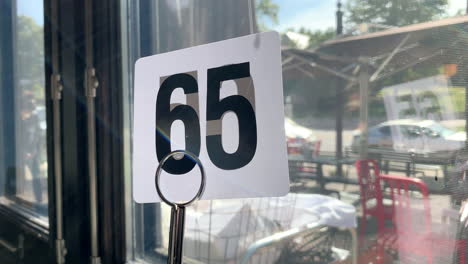 number-65-at-a-table-at-a-restaurant-near-a-window-on-a-sunny-fall-day