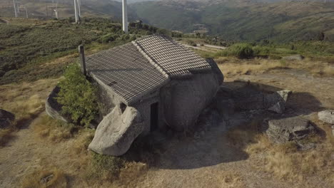 The-famous-Stone-House-in-Portugal,-aerial-shots-in-4K