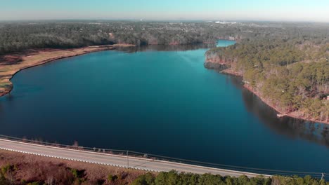 4k-aerial-footage-of-a-lakefront-road-in-Columbia,-SC