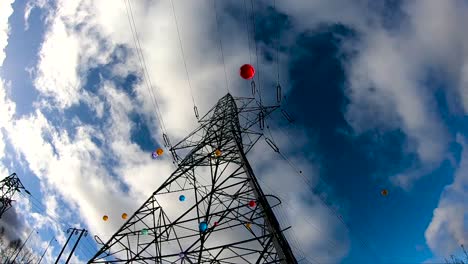colorful-balls-bouncing-near-the-electrical-tower