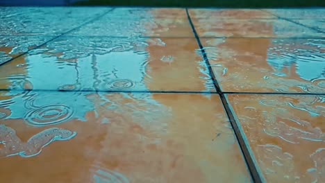 Rain-water-falling-on-outdoor-floor-tiles