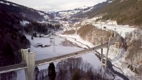 Panorama-shot-of-a-very-high-and-curvy-bridge-in-Switzerland