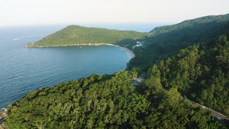 Aerial-view-approaching-the-jungle-mountain-from-Interpraias-road-at-Balneario-Camboriu,-Santa-Catarina,-Brazil