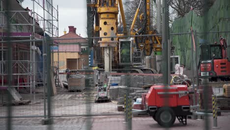 Big-construction-machine-working-inside-of-Liseberg-amusement-park-in-Gothenburg,-Sweden