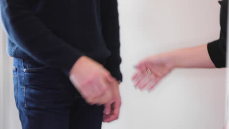 Man-and-woman-shaking-Hands-in-slow-motion