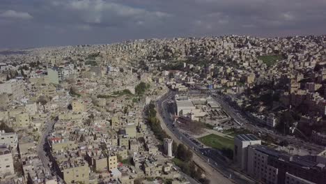 Beautiful-aerial-clip-overcast-day-of-gray-skies-over-Amman-Jordan-showing-the-city's-multi-tiered-architecture-and-landscape---taken-by-a-drone